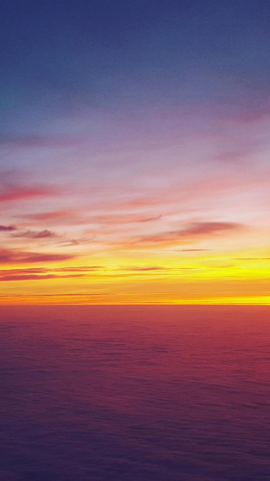 余晖下的夕阳手机壁纸